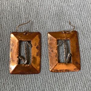 Earrings.  Handmade in New Orleans.  Saxophone in the center of the square.